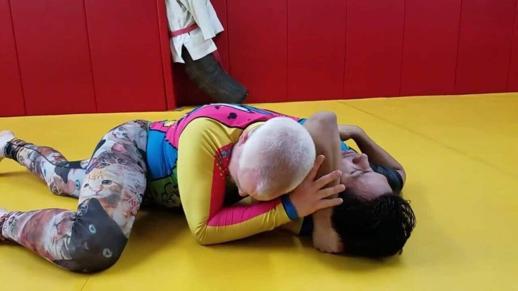 Shoulder lock counter to arm triangle defense