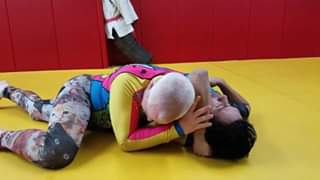 Shoulder lock counter to arm triangle defense