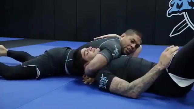 Bach attacks with Andre Galvao