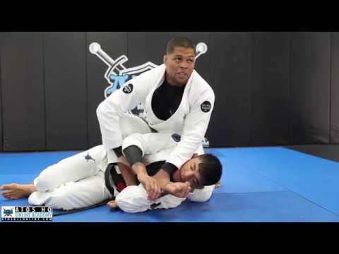 Basic and modified hip bump sweep from closed guard + arm bar from mount position - Andre Galvao