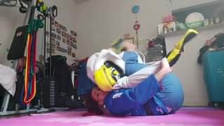 Claudia Do Val demonstrates a slick setup for the overhead half guard sweep. 
 C...