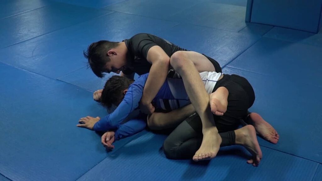 Closed guard armdrag back take