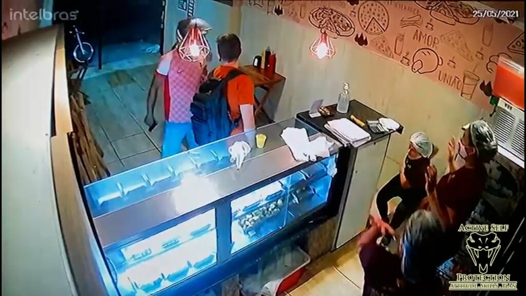 Customer Waits His Turn Perfectly Against Robbers