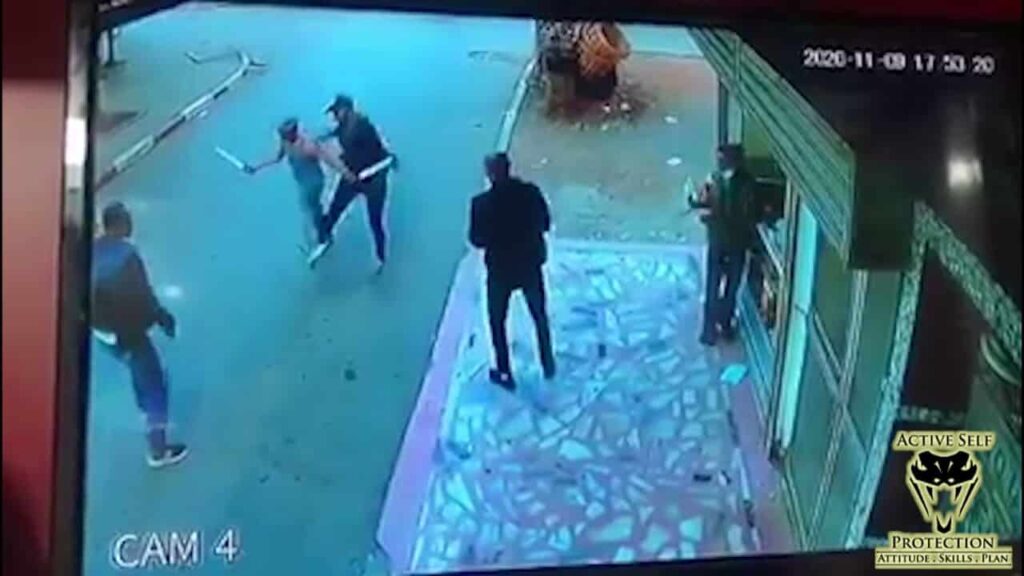 Defender Uses A Surprise Foot Sweep On Dual-Wielding Attacker