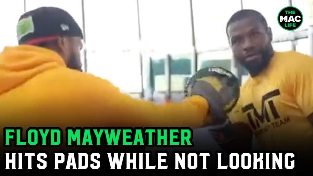 Floyd Mayweather shows off and hits the pads without looking