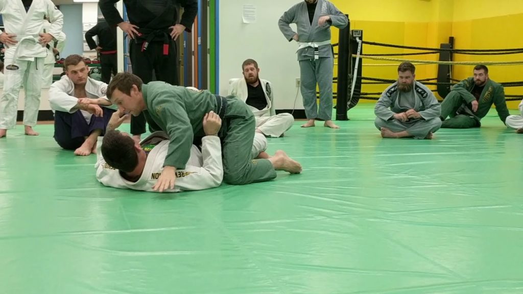 Half guard bridge to underhook and counter to whizzer