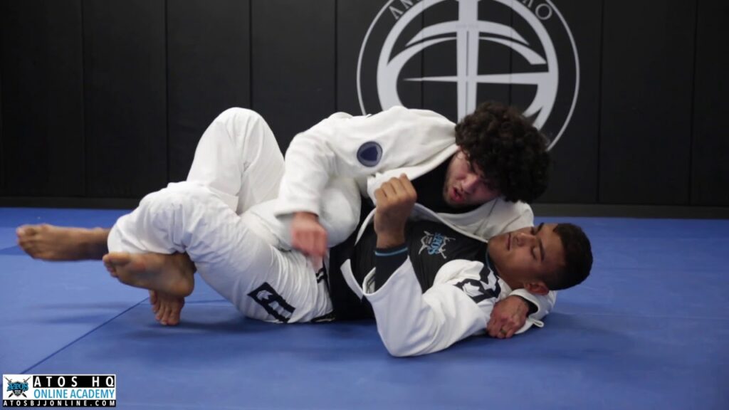 Half guard pass using the lapel to mount + collar choke - Mike Carbullido