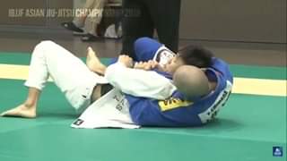 Hitting the “Assassin’s Lapel Crucifix Choke” in competition