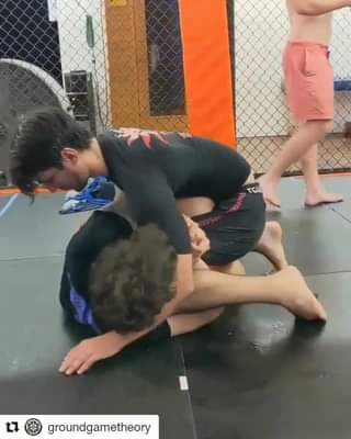 Kneebar from Half Guard using a low knee shield