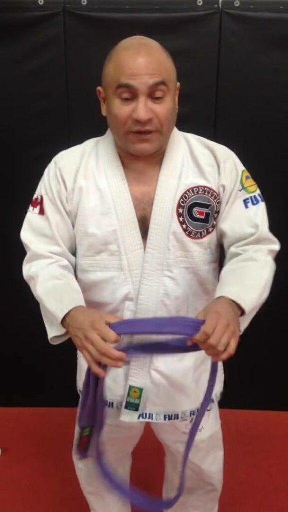 Man promotes himself to new belt in Brazilian Jiu Jitsi