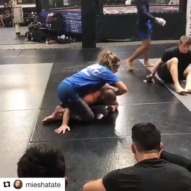 Miesha Tate​ showing guillotine from a back side crucifix