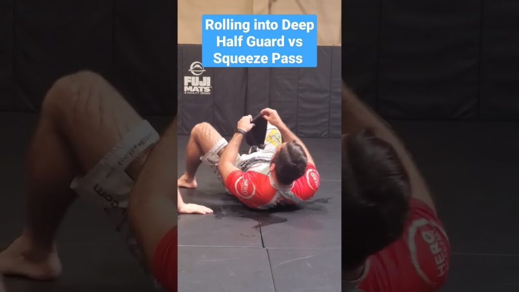 Rolling into Deep Half Guard vs Squeeze Pass