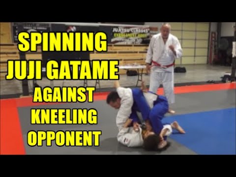 SPINNING JUJI GATAME AGAINST A KNEELING OPPONENT