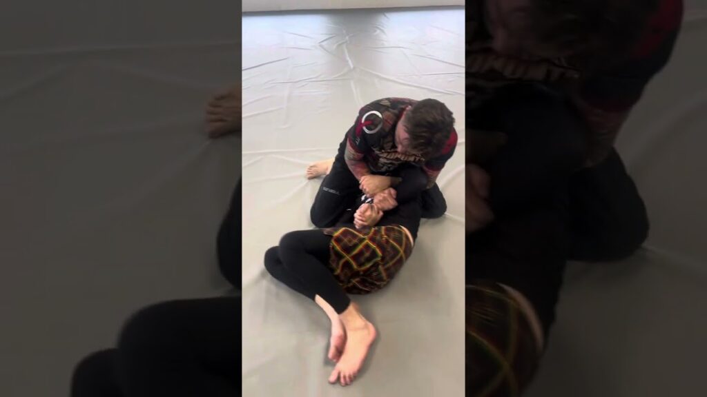 Scissor Choke from Kimura Grip
