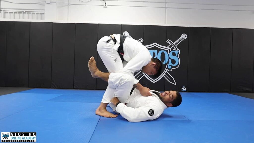 Scissors sweep using the lapel + arm bar from mount position - Andre Galvao