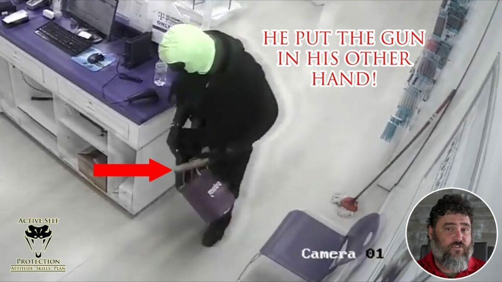 Shop Employee Shows Compliance In Phone Store Robbery