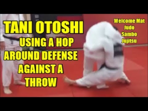 TANI OTOSHI USING A HOP AROUND DEFENSE AGAINST A THROW