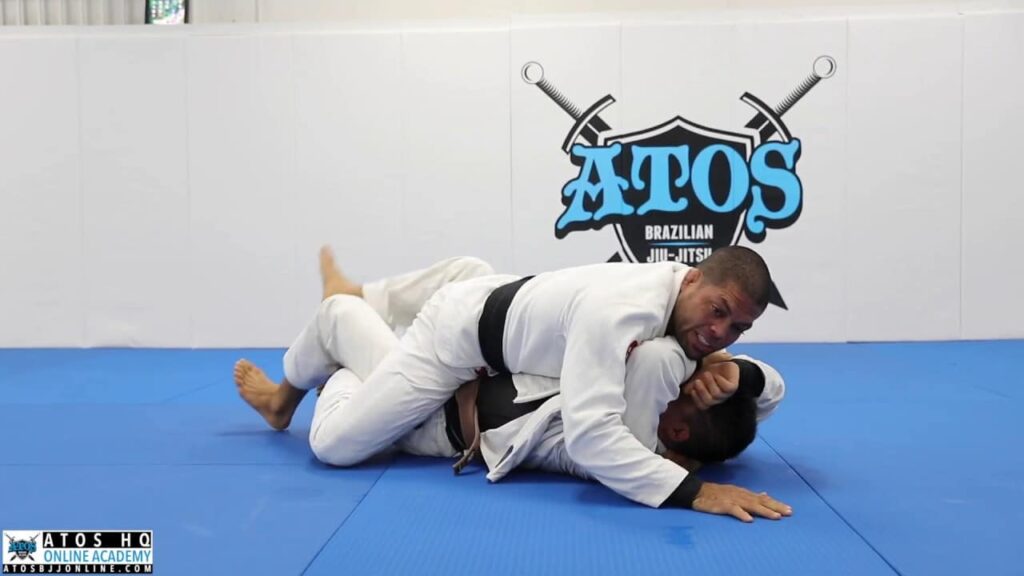 Transition from side control to arm bar - Andre Galvao