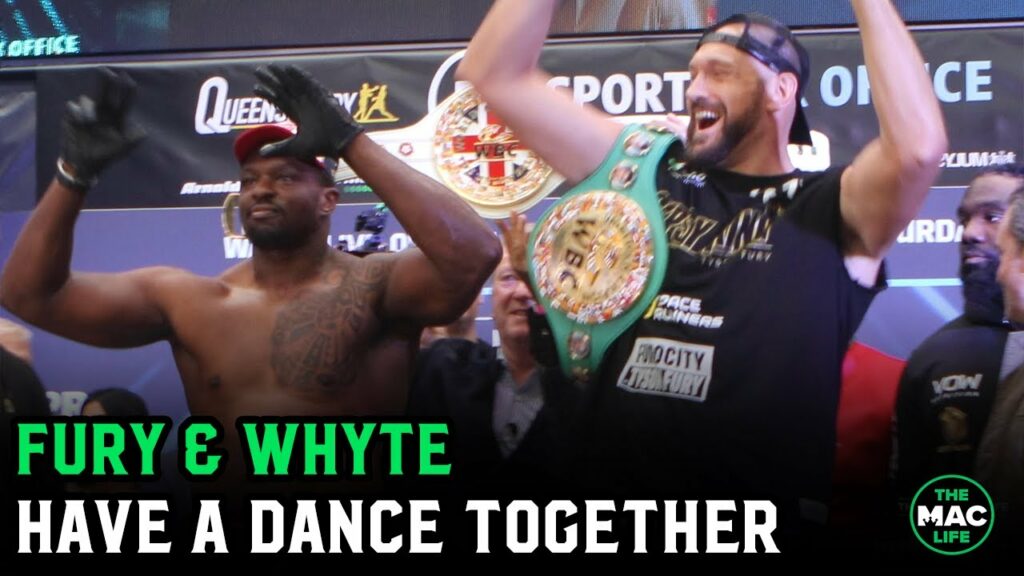 Tyson Fury and Dillian Whyte dance together at the weigh-ins