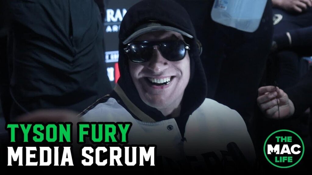 Tyson Fury sings, laughs and tells reporters to "back the f*** up"