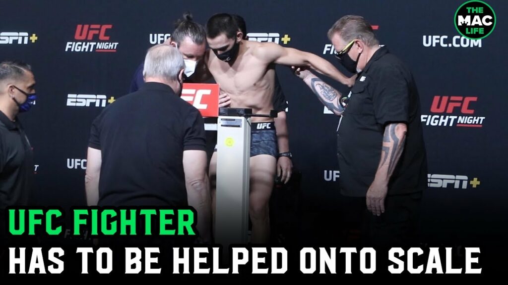 UFC Fighter Ryan Benoit has to be helped onto scales after weight cut