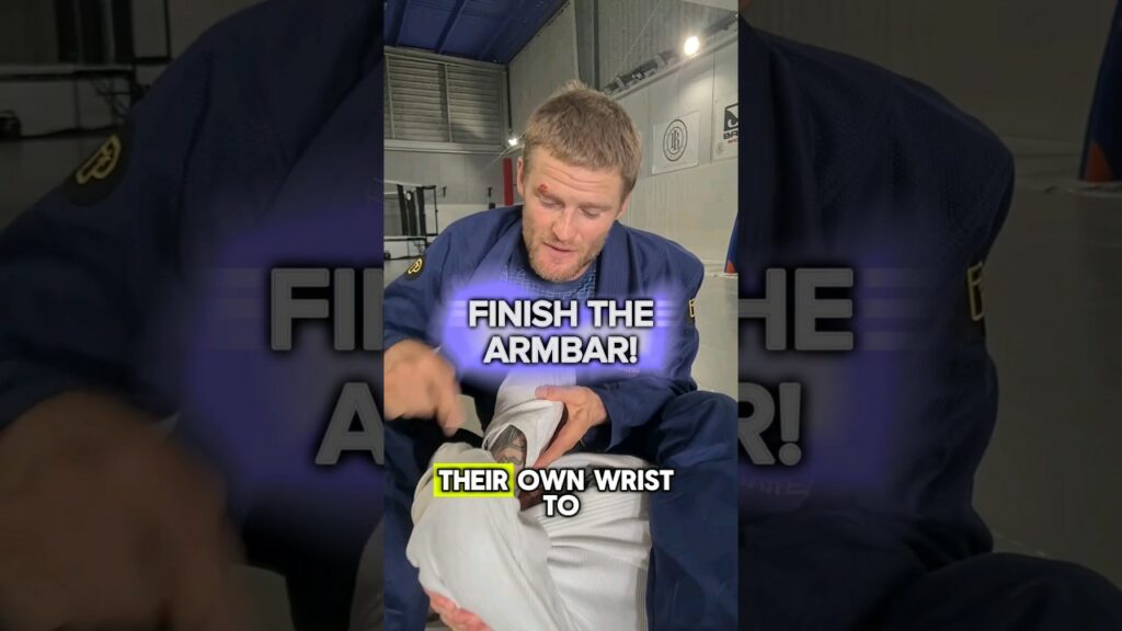 Use this detail to finish the armbar when they're gripping up with a rear naked choke style grip
