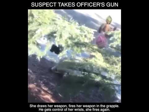 WARNING: Suspect Takes Officers Gun and Fires at Her